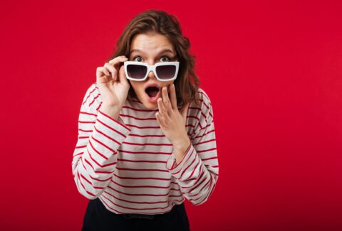 portrait-shocked-woman-sunglasses-min