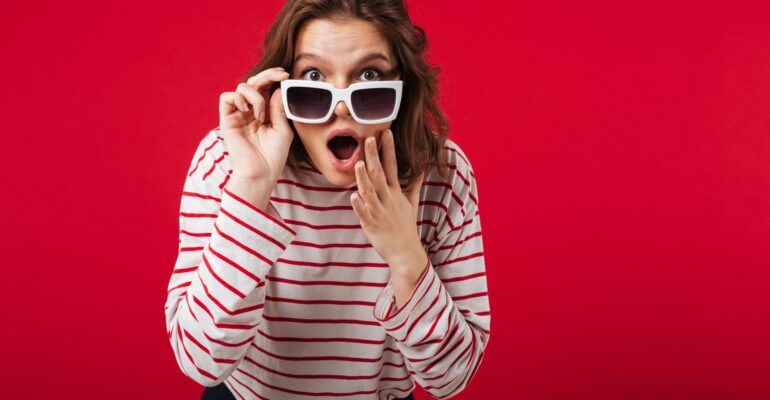 portrait-shocked-woman-sunglasses-min